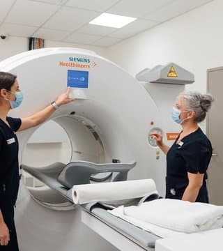 MRI machine with clinicians
